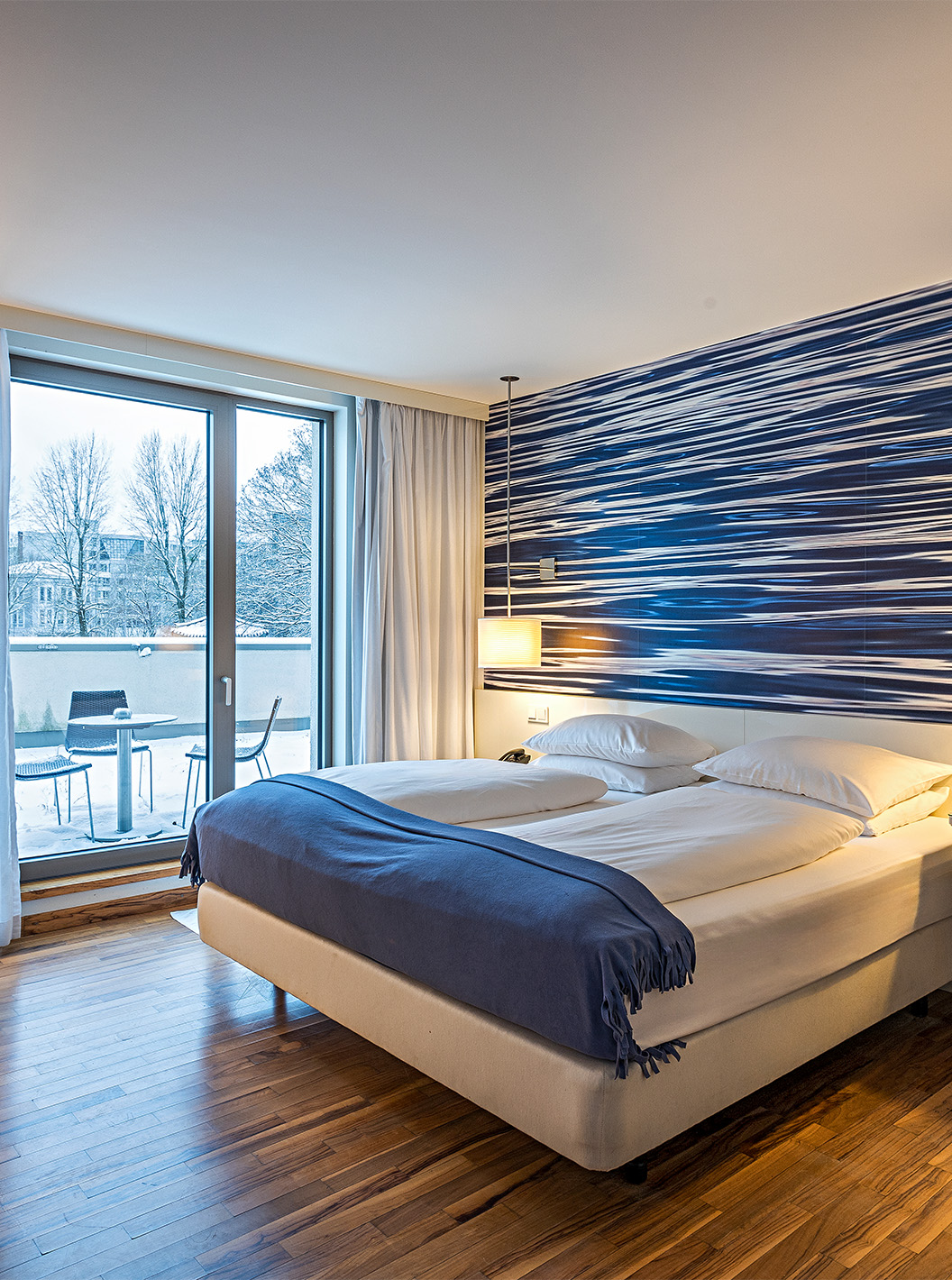 Deluxe Room with Terrace at Pestana Berlin Tiergarten has a double bed, desk and an armchair