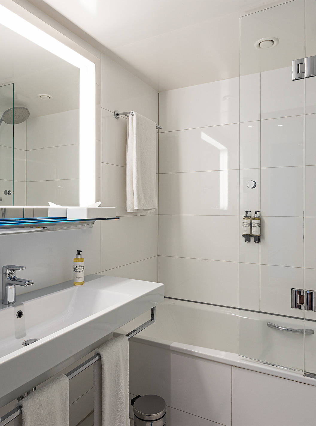 Premium Room with Panoramic Balcony at Pestana Berlin Tiergarten has a bathtub and shower, and sink with mirror