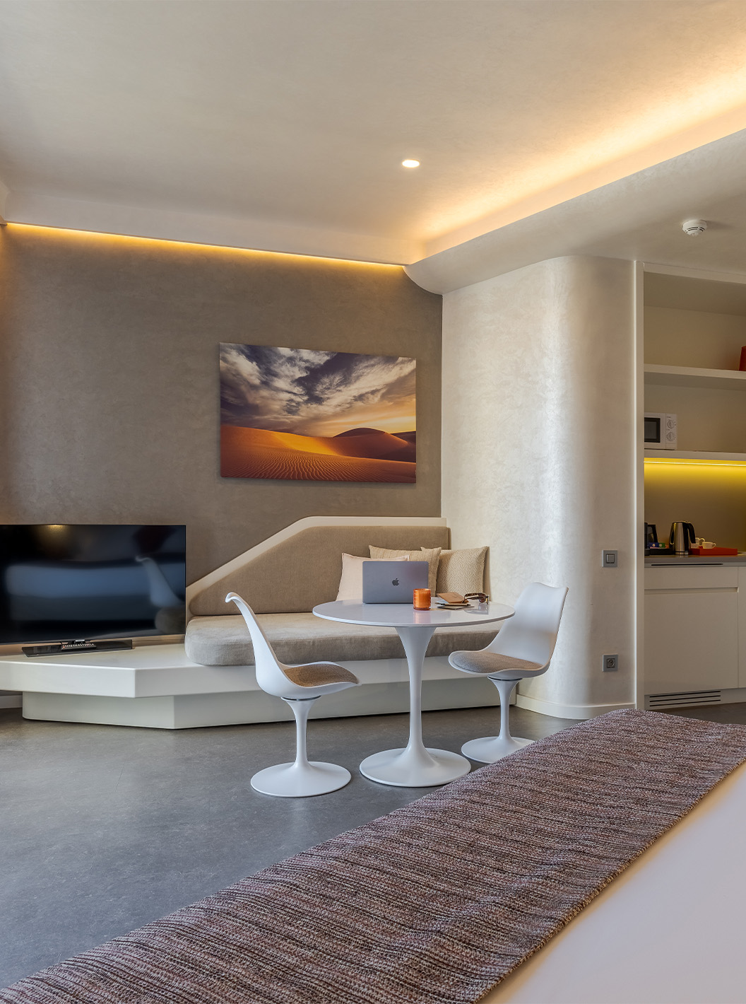 The CR7 Room Avenue at Pestana CR7 Marrakech has a TV, a sofa next to it, a sink, and a microwave