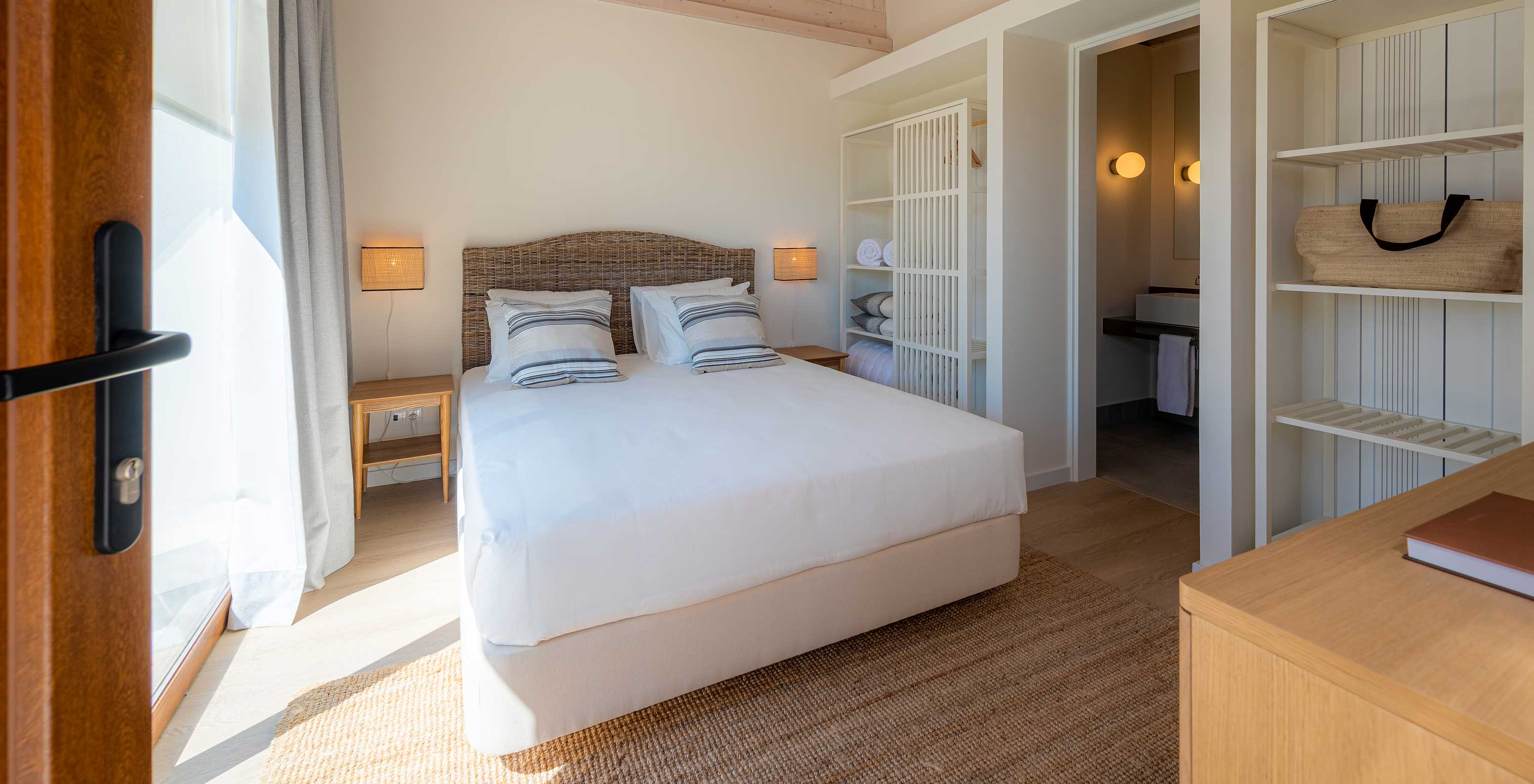 The Standard Villa at Pestana Comporta Village Residences has a bedroom with a double bed and simple decor