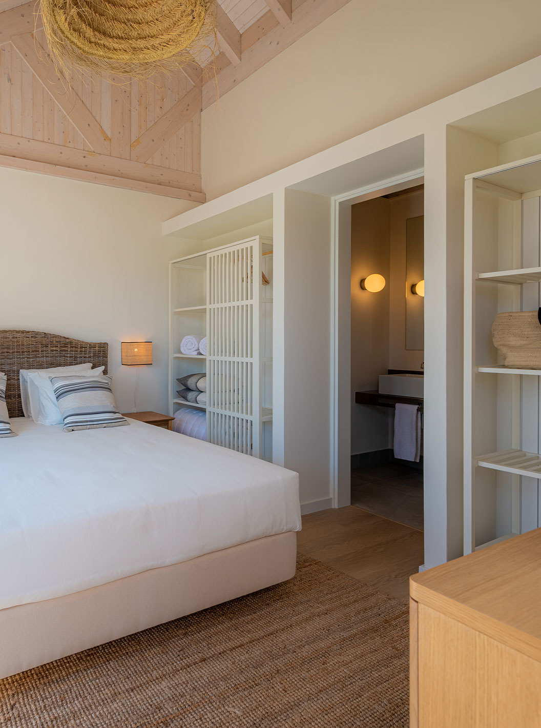 The Standard Villa T2 at Pestana Comporta Village Residences has a bedroom with a double bed and simple decor