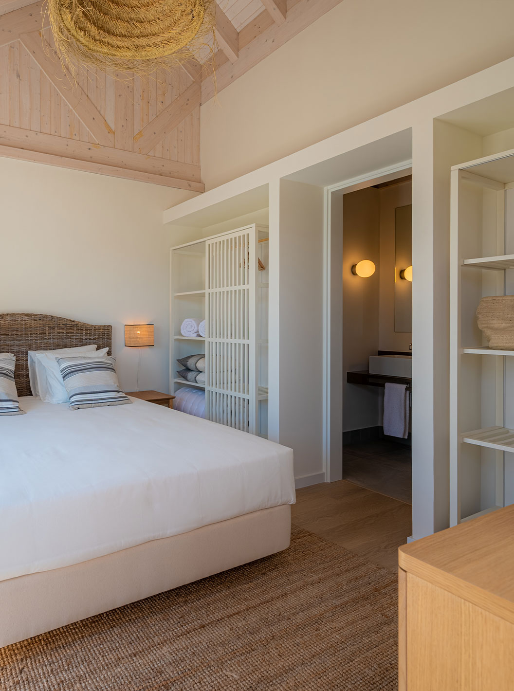The Standard Villa at Pestana Comporta Village Residences has a bedroom with a double bed and simple decor
