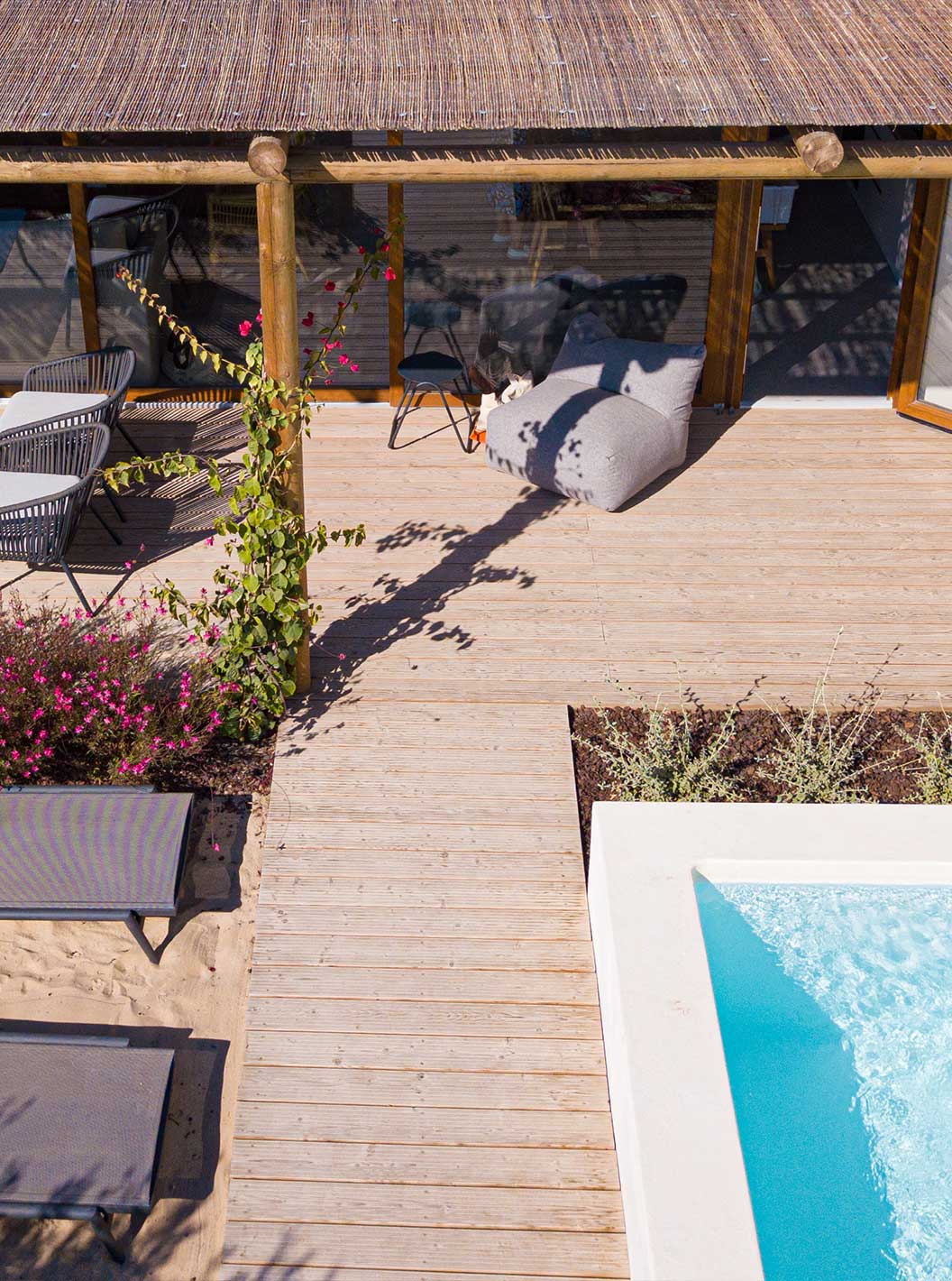 The Standard Villa at Pestana Comporta Village Residences has a terrace with a pool, sun loungers, and plants