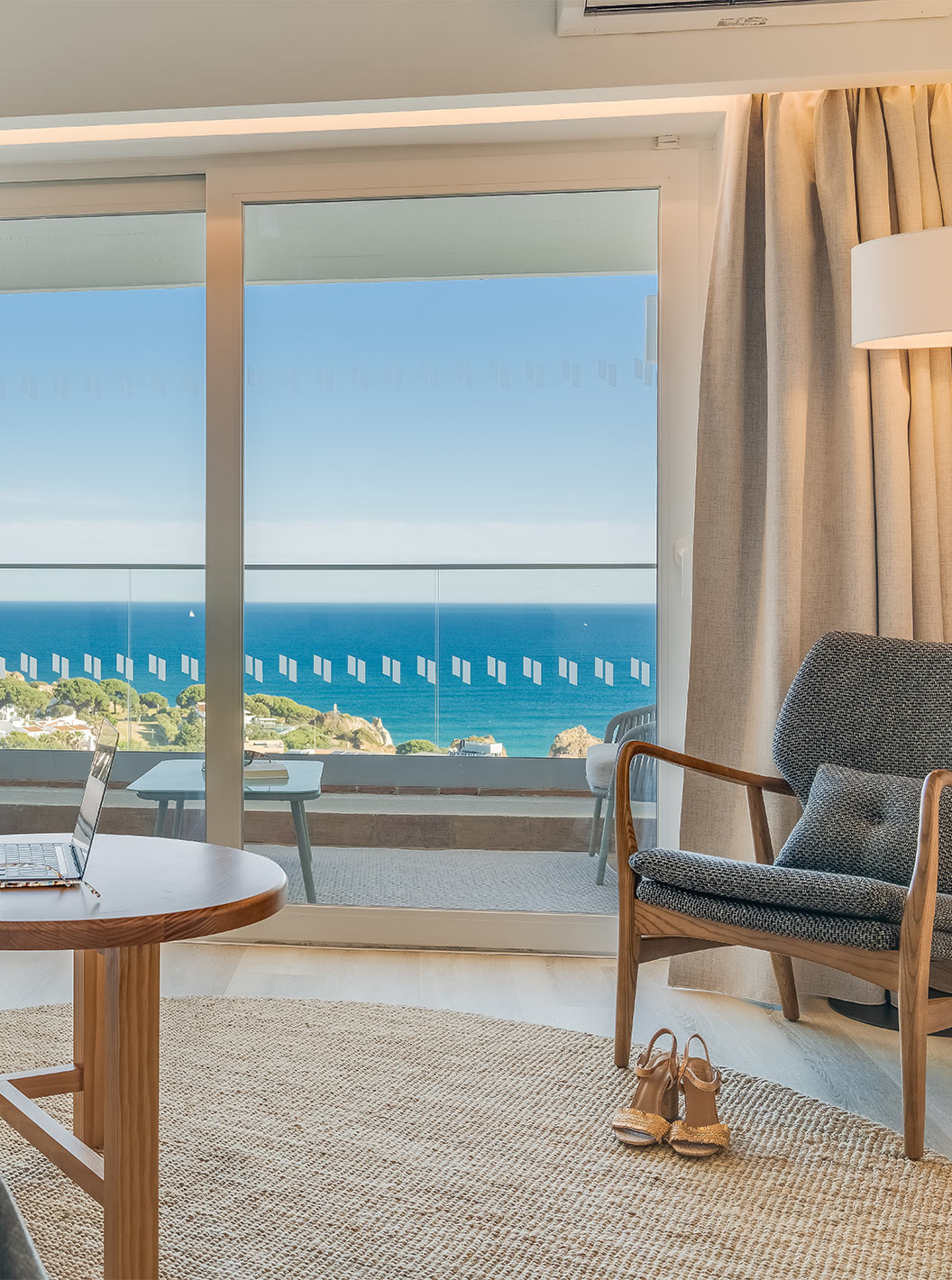 The Classic Sea View Room at Pestana Blue Alvor Beach has a balcony with a small table, two chairs, and a sea view