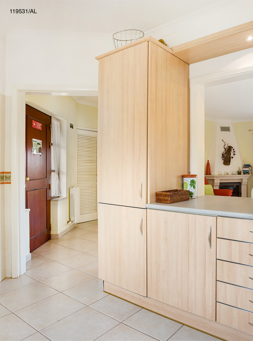 The Pestana Carvoeiro Golf T1 Standard Apartment has an entry to a kitchen with wooden cabinets