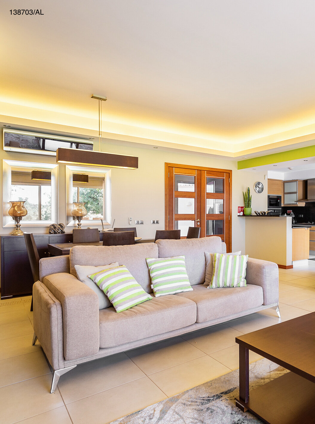 The Pestana Carvoeiro Golf T2 Superior Apartment has a living room with two beige sofas and a coffee table