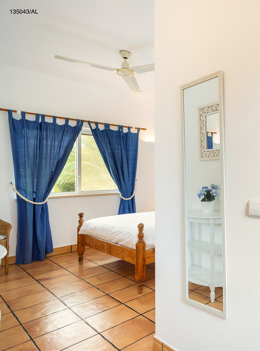 The Pestana Carvoeiro Golf V4 Standard Villa has a bedroom with a bathroom and a mirror