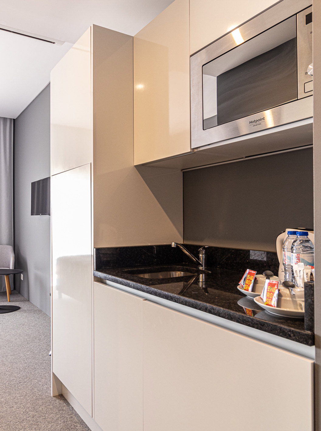 Classic Room at Pestana Gramacho has kitchenette with microwave, kettle, and cupboards