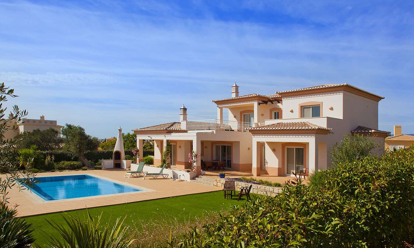 The V3 Villa at Pestana Gramacho Residences features a private garden with barbecue, pool, sun loungers, and chairs