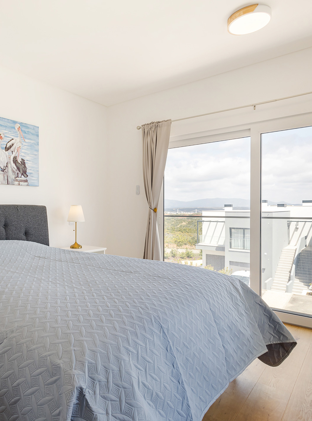 The First Floor 3 Bedroom Apartment - 6 Adults at Pestana Valley Nature Village has a bed and curtains in shades of grey