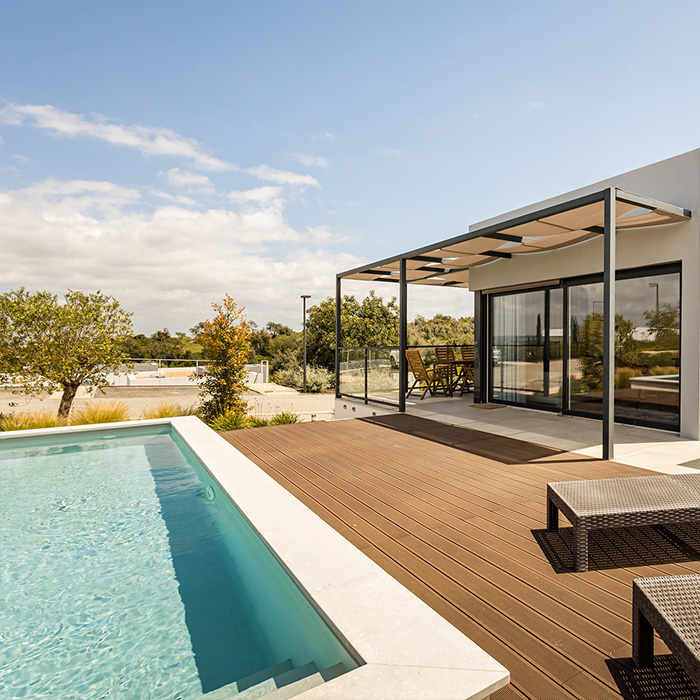 Modern terrace at Pestana Valley Nature Village with Villas in the Algarve, with a pool and natural surroundings
