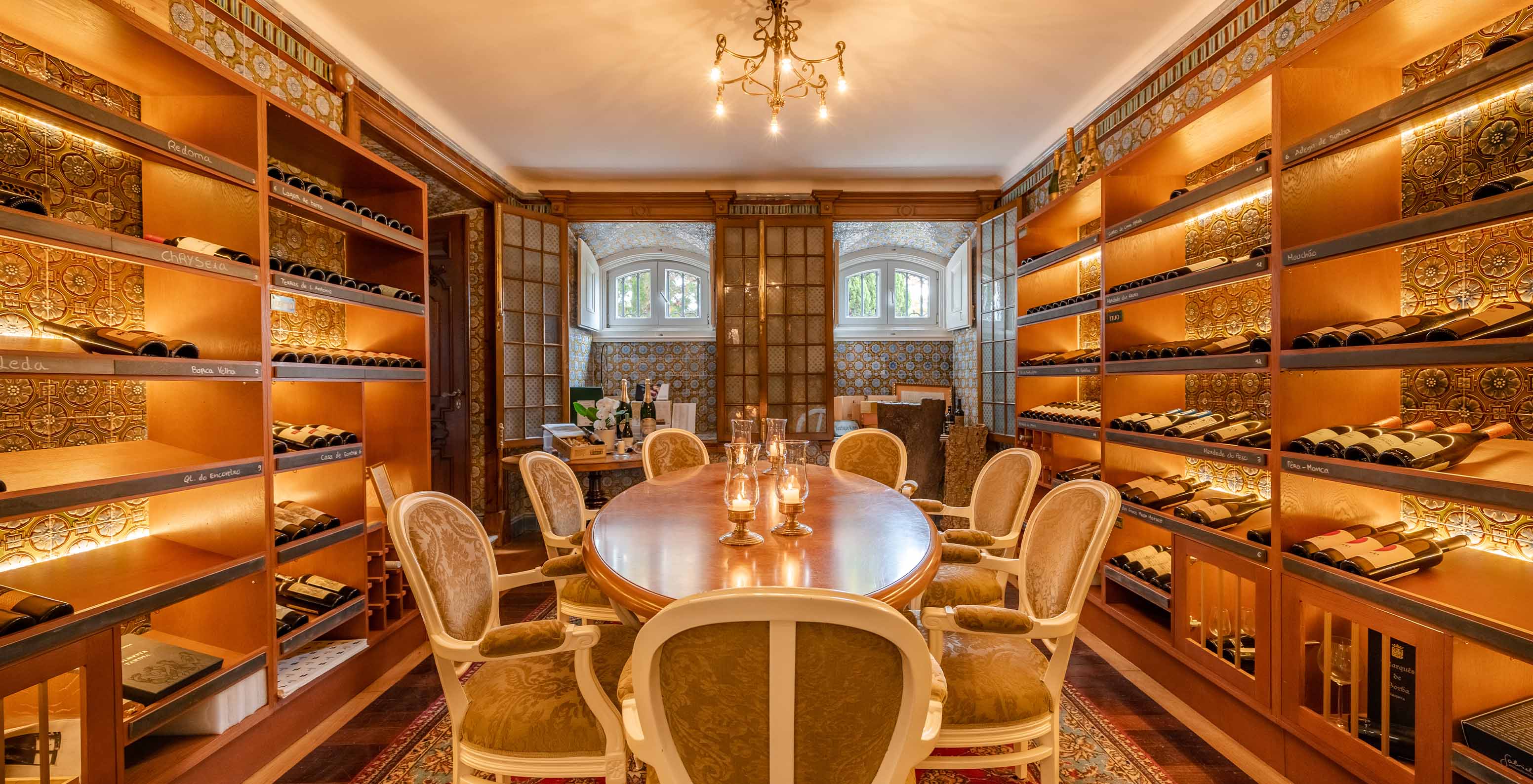 Wine boutique with a central table and cellar design at Palace Lisboa, a hotel in a palace in Lisbon