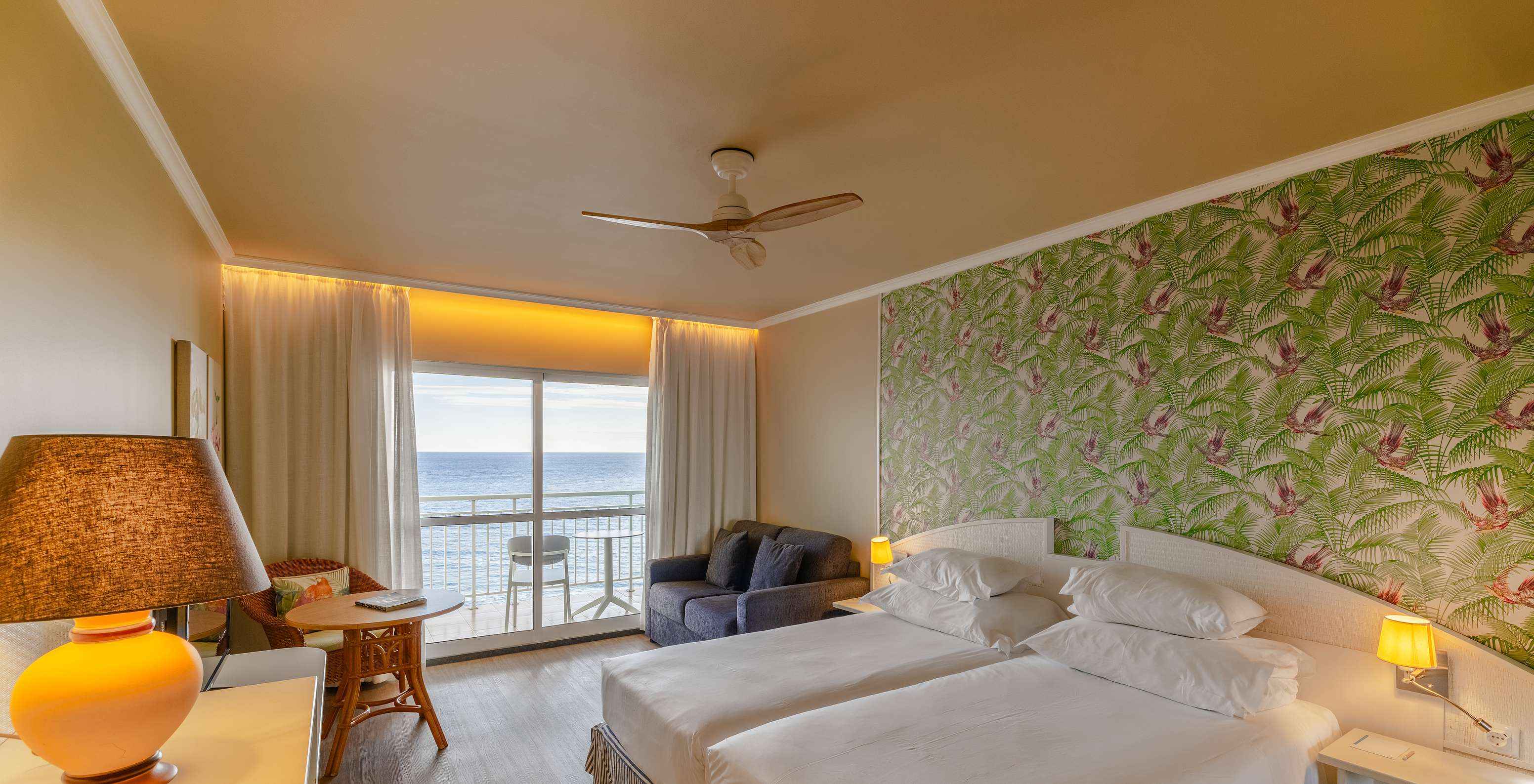The Pestana Ocean Bay All Inclusive Premium Sea View has a double bed, a balcony with sea view, and a sofa