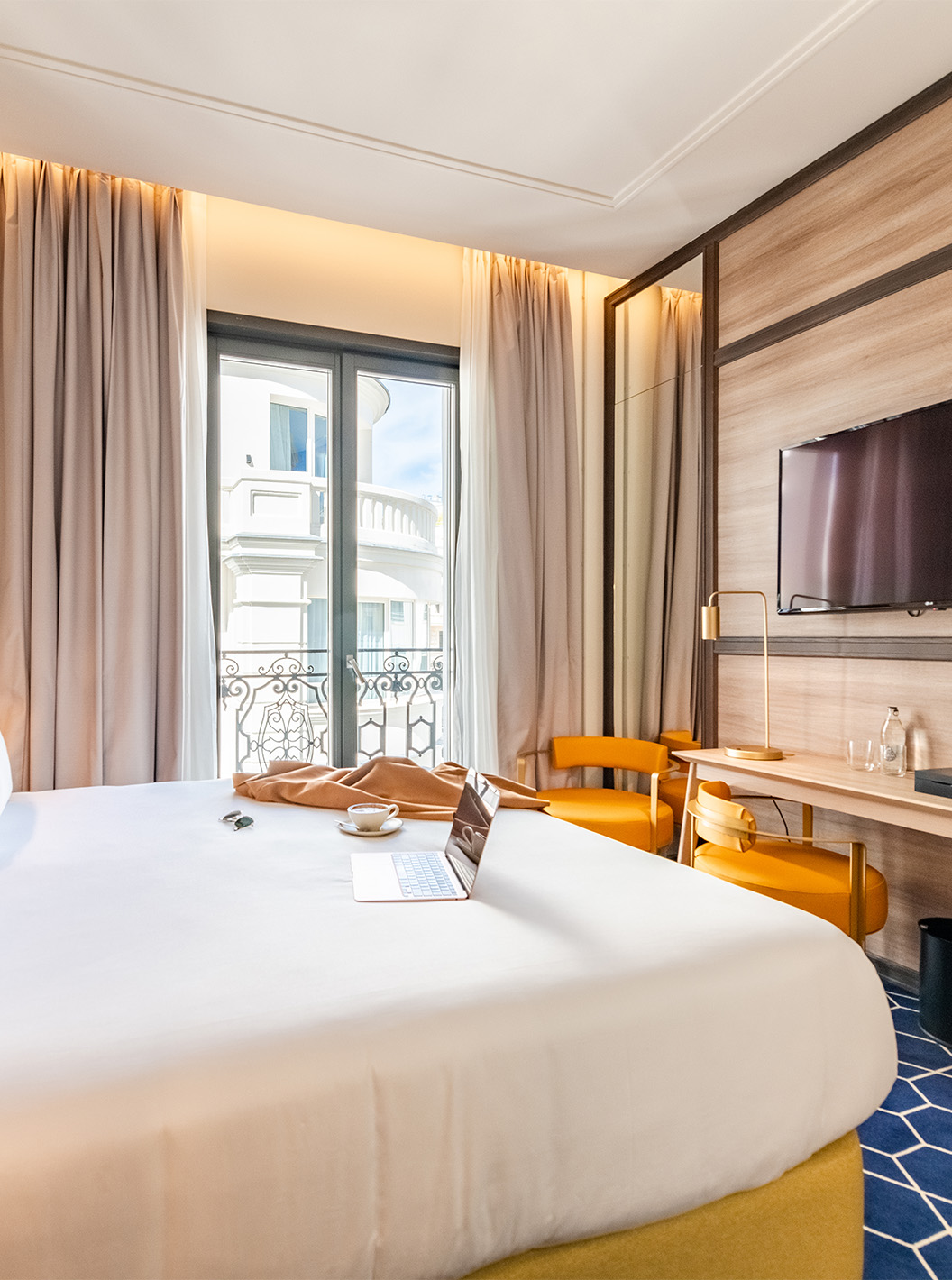The Premium Grand Room at Pestana CR7 Gran Vía Madrid features a double bed, television, and large windows