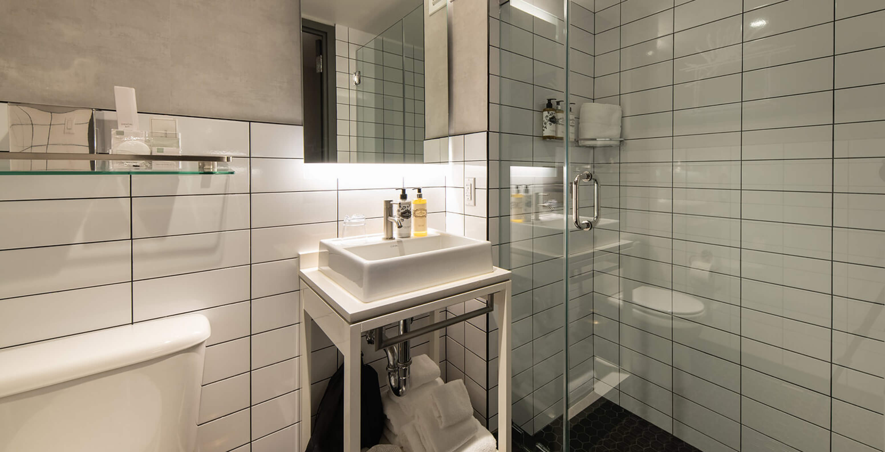 The Comfort Street View at Pestana CR7 Times Square has a bathroom with shower, sink, mirror, and toilet