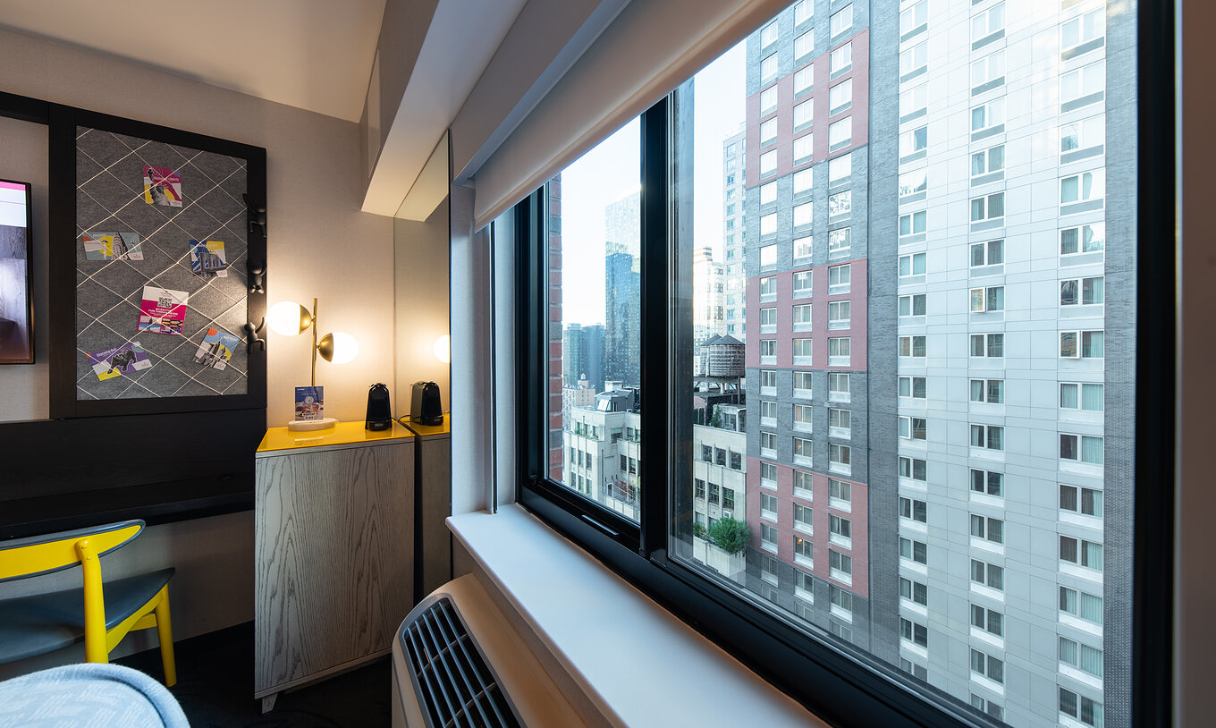 The Superior King High Floor ADA at Pestana CR7 Times Square has a window, air conditioning, and a desk
