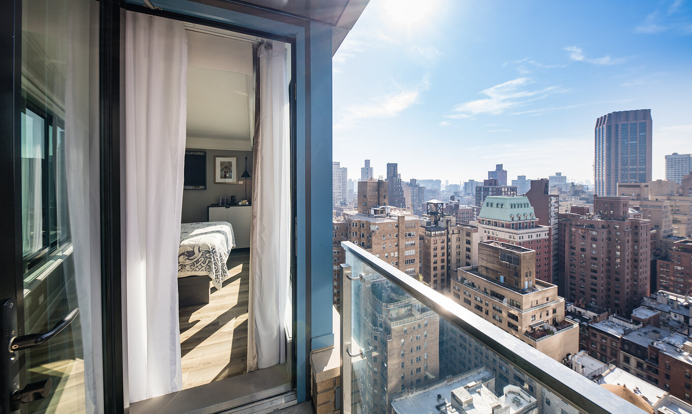 The Balcony room at Pestana Park Avenue has a balcony with a panoramic view of downtown Manhattan