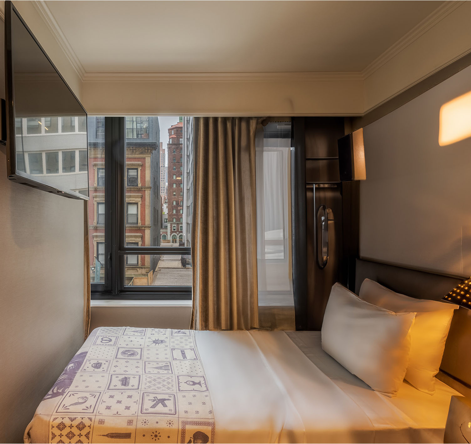 Cabin - ADA at Pestana Park Avenue has a double bed by the window and a television on the wall