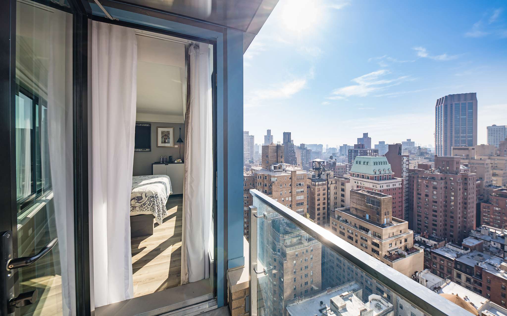View from the balcony of the room at Pestana Park Avenue to the city of Manhattan, New York, on a clear sky day