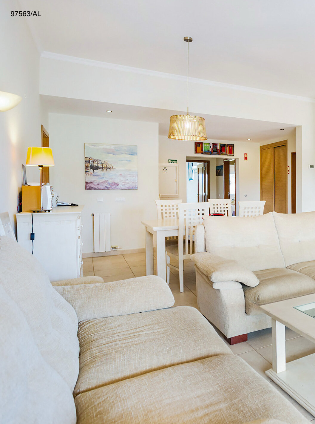 The Pestana Carvoeiro Golf T3 Superior Apartment has a living room with two beige sofas, a coffee table, and TV