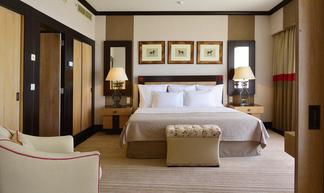 The Presidential Suite at Pestana Vila Sol - Vilamoura has a bedroom with double bed and two bedside tables with mirror