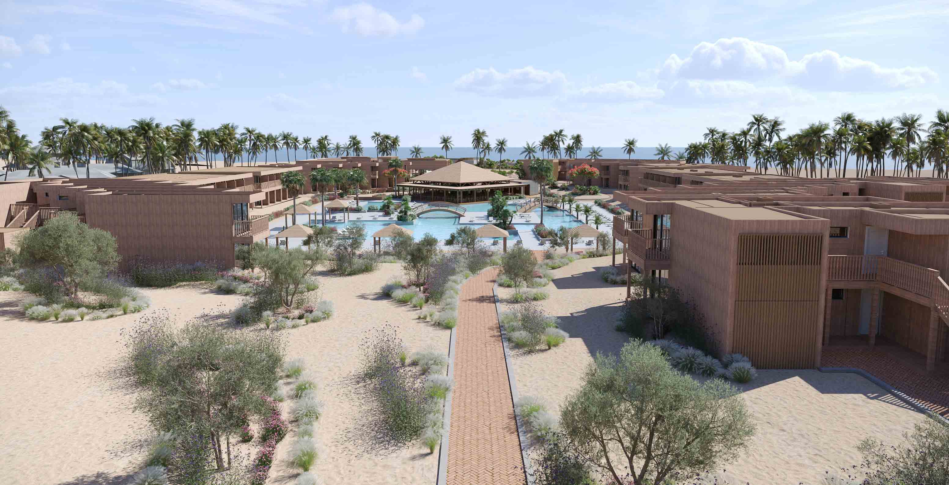 Vista exterior do Pestana Dunas Porto Santo com edifícios em madeira, piscina central e palmeiras junto à praia