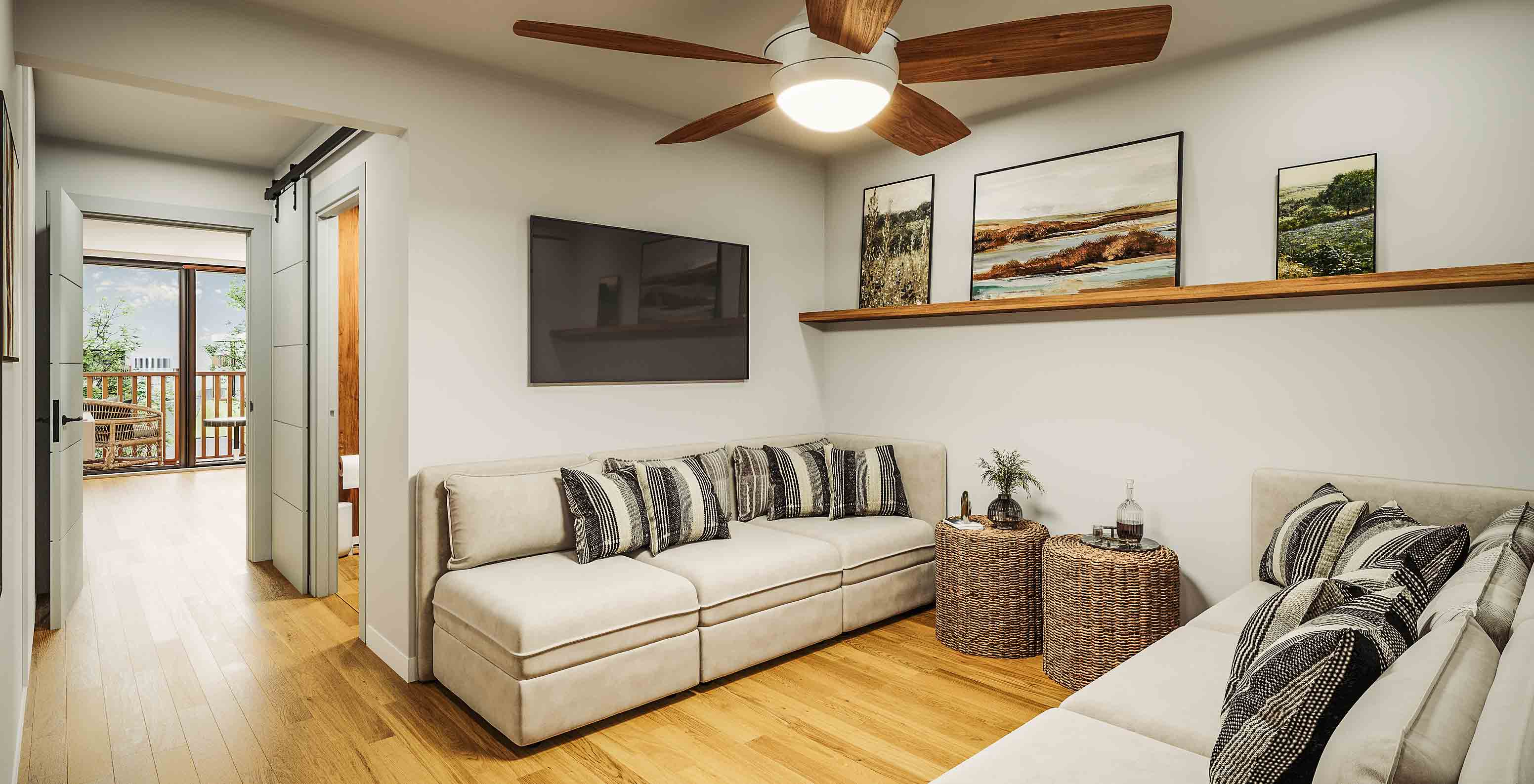 Sala de estar luminosa com sofás bege e almofadas listradas, mesa de vime e varanda ao fundo no Pestana Dunas Porto Santo