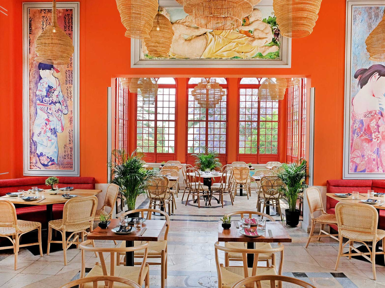Casa do Lago restaurant at the 5-Star Hotel, National Monument, has a red room with tables, chairs and a window