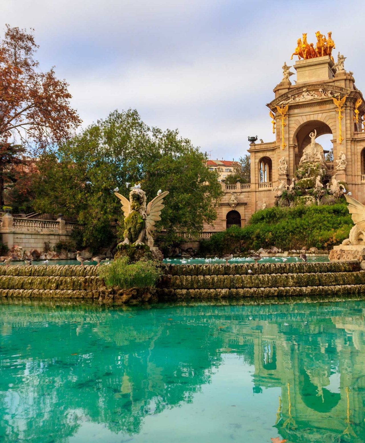 The impressive Monumental waterfall in Parc de la Ciutadella, Barcelona, with its golden sculptures and crystal-clear water