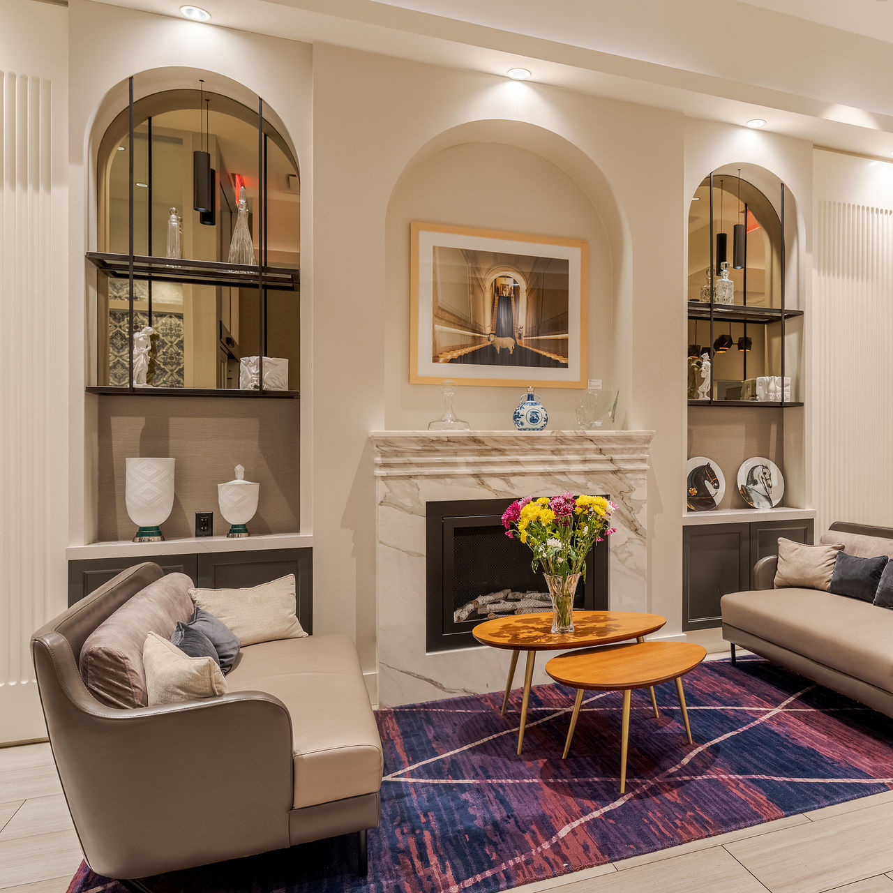 Entrance area of Pestana Park Avenue, with a sophisticated design featuring furniture, rugs, and artworks