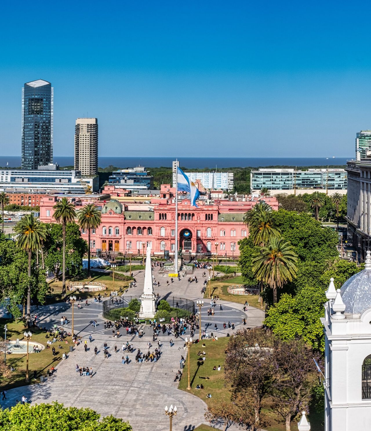 Aerial view of Plaza de Mayo, with the seat of the Argentine government and the Cabildo, with people strolling